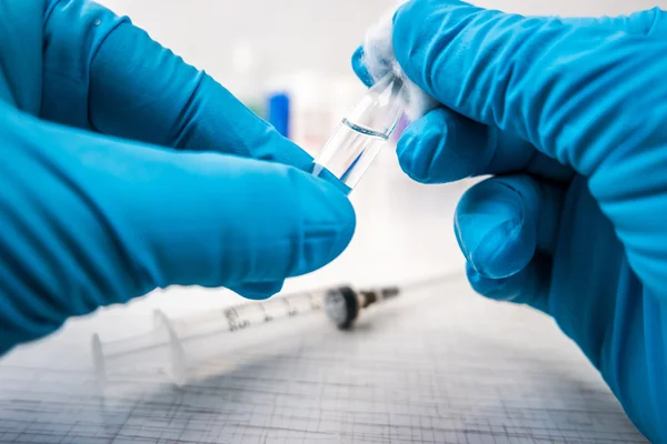 Doctors hands in blue robber gloves — Stock Photo, Image