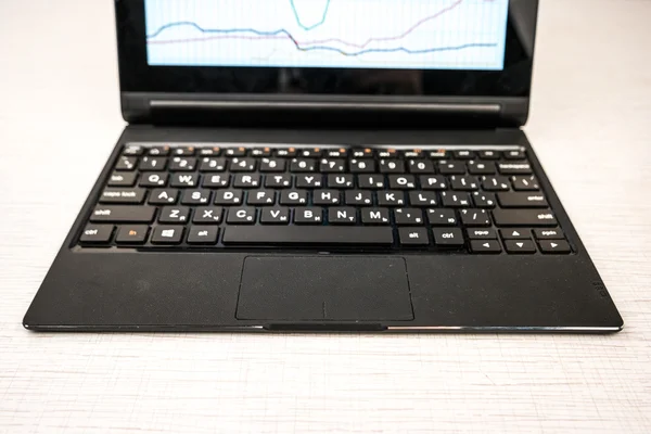 Laptop with hands on wood — Stock Photo, Image