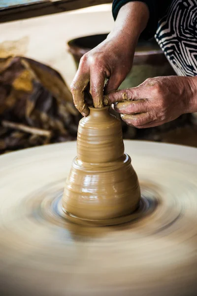 Closeup view of hands of an old asian potter — Stock Photo, Image