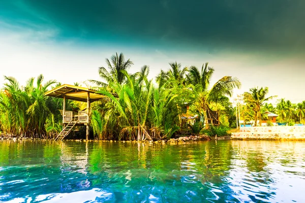 Stilt houses above river in rural Thailand. — Stock Photo, Image