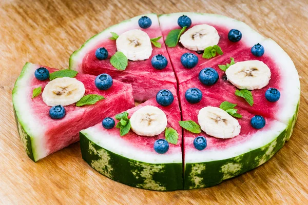 Watermelon pizza on wood — Stock Photo, Image