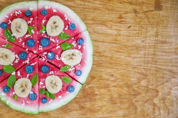 Watermelon pizza on wood — Stock Photo, Image