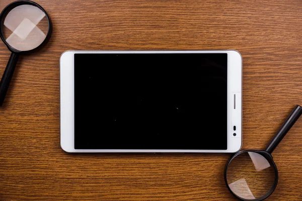 Gadget na mesa de madeira — Fotografia de Stock