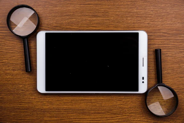 Gadget na mesa de madeira — Fotografia de Stock