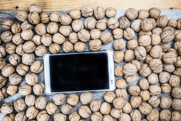 Plenty of walnuts with tablet pc