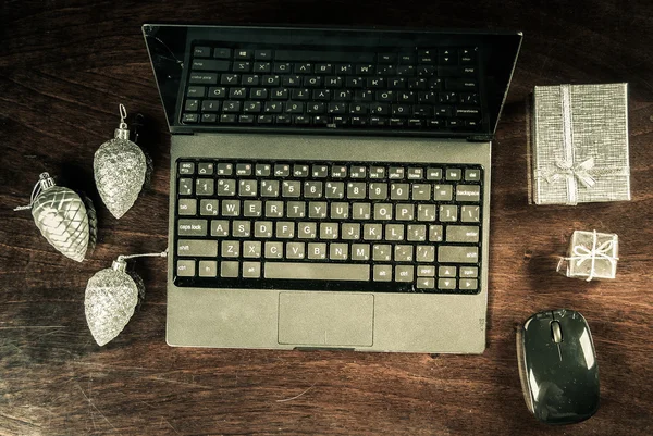 black laptop on wood