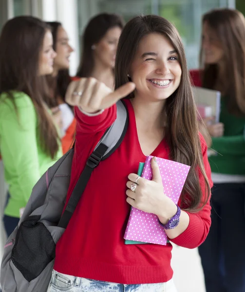 Smiling teenagers with exercise books — Stock Photo, Image