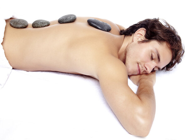 Young man enjoying spa treatment