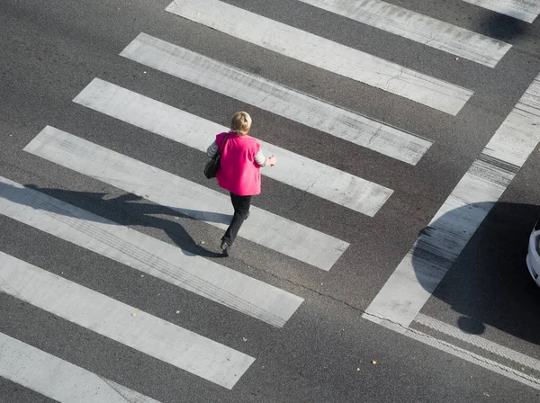 Top View of a Pedestrian Crosswalk with Blonde Woman