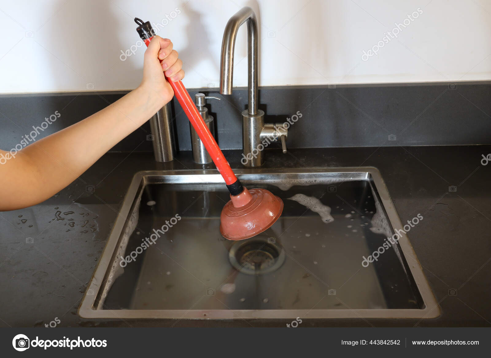 Overflowing Kitchen Sink Clogged Drain Hand Holding Plunger Force Cup
