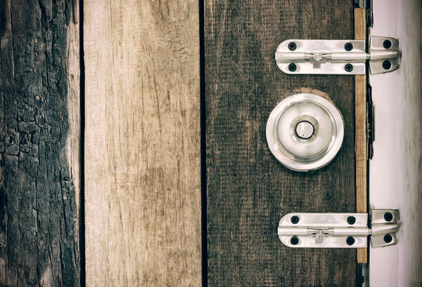 Old lock on the door of an old farmhouse . true village style . 