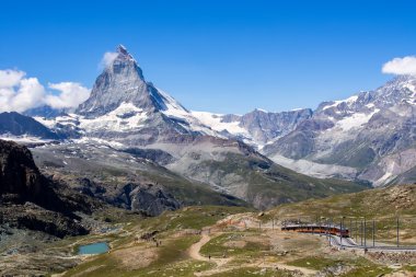 Matterhorn peak with a train , Switzerland clipart