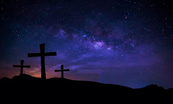 Cross silhouette on mountain with milky way in the sky. Conceptu — Stock Photo, Image