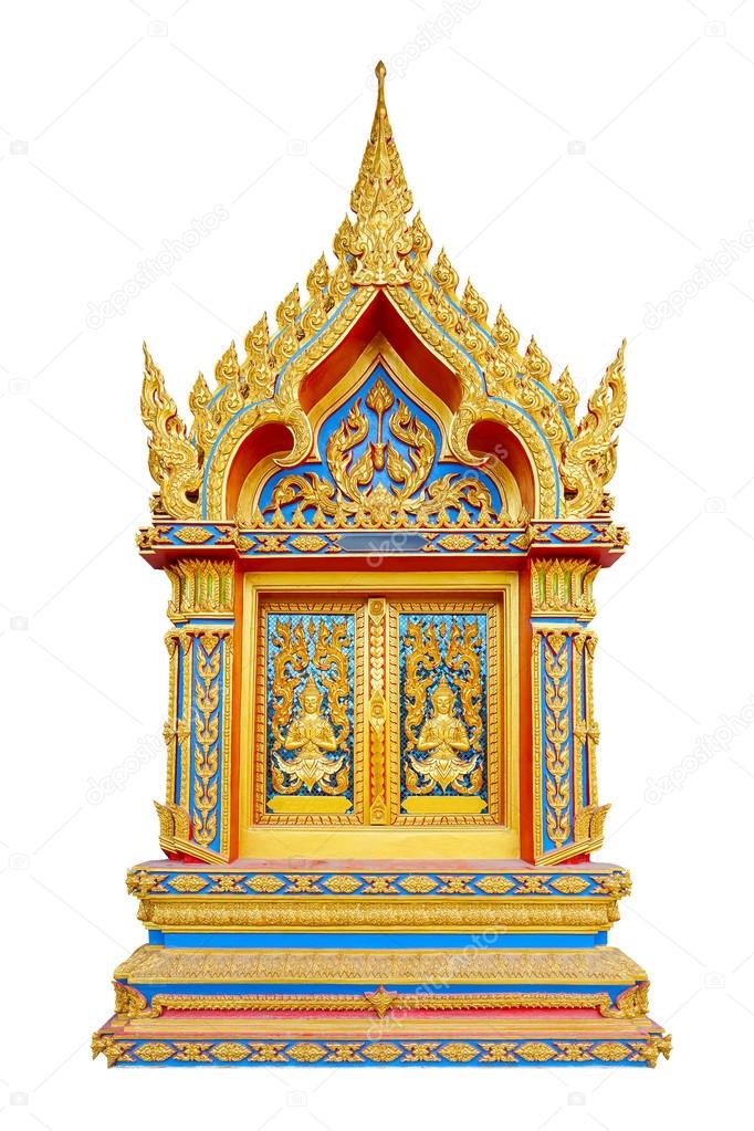 Carving of Thai Temple door in golden color. Isolated on white.