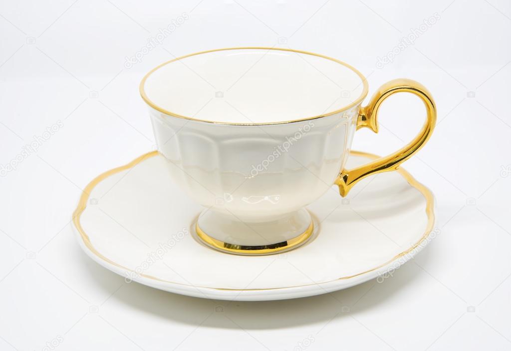 Antique porcelain tea cup on white background