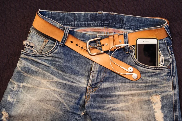 Texture background of jeans , belt detail with mobilephone and e Stock Picture