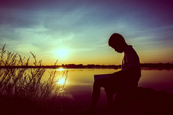 boy reading,silhouette concept