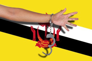 kelepçe elle Brunei bayrağı