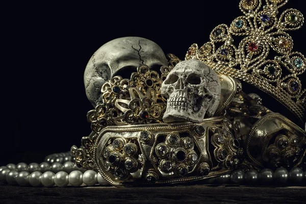 Still life Skull with Treasure Gold jewelry, pirate concept.