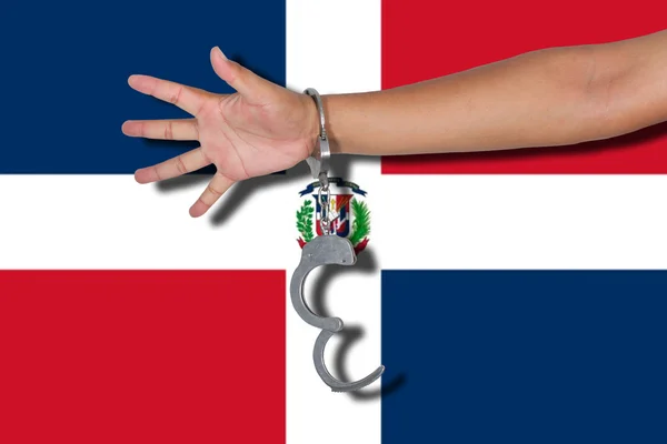 Manette Con Mano Sulla Bandiera Della Repubblica Dominicana — Foto Stock