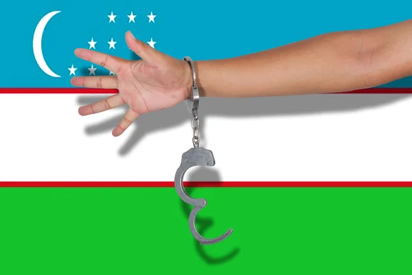 Håndjern Med Hånd Usbekistan Flag - Stock-foto