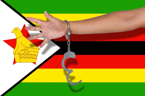 Χειροπέδες Χέρι Για Σημαία Της Ζιμπάμπουε — Φωτογραφία Αρχείου