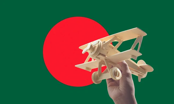 Avión Mano Sobre Bandera Bangladesh Concepto Viaje — Foto de Stock