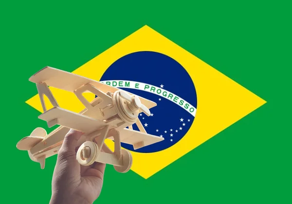 Avião Mão Sobre Bandeira Brasil Conceito Viagem — Fotografia de Stock