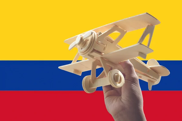 Hand Holding Airplane Plane Colombia Flag Travel Concept — Stock Photo, Image