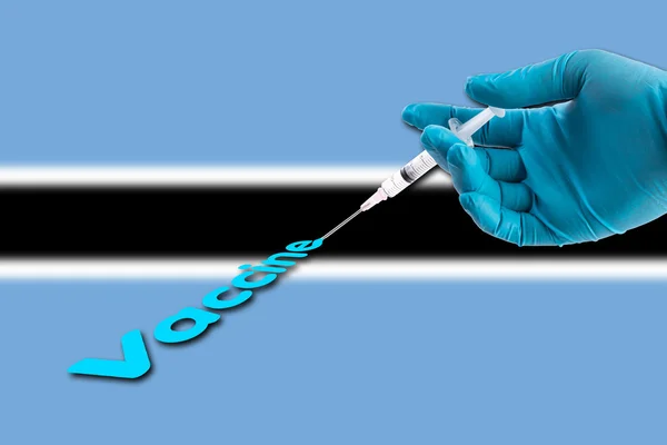 Hand Een Blauwe Handschoen Bedrijf Spuit Injecteren Vaccin Tekst Botswana — Stockfoto