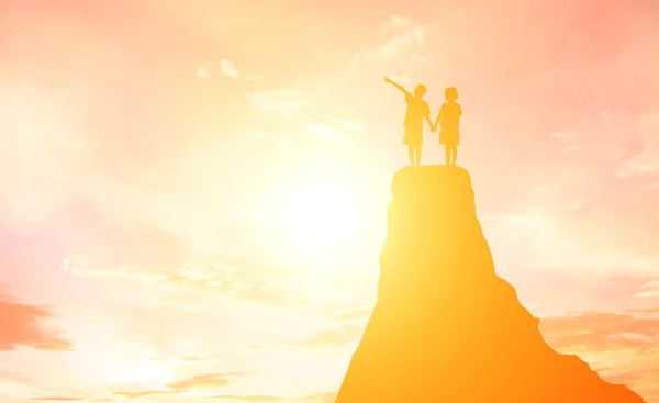 Silhouette boy and girl pointing to the future. — Stock Photo, Image