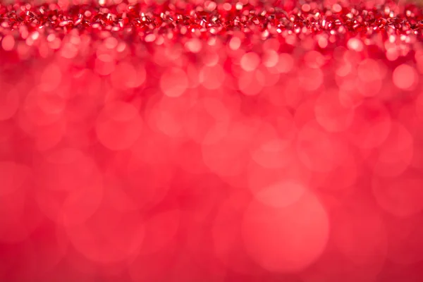 Červená bokeh holiday texturou pozadí vánoční ozdoby — Stock fotografie