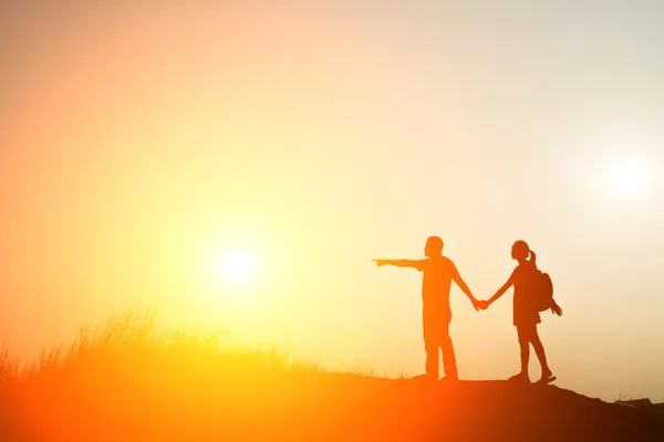 Silhouette of sweet couple walking to travel