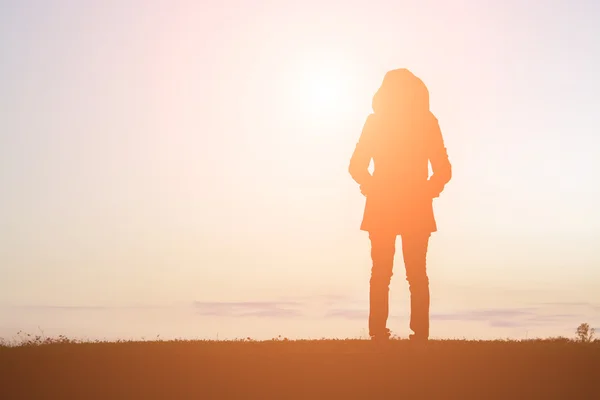 Silhouette of woman loneliness standing alone — Stock Photo, Image