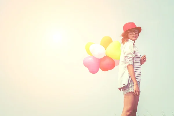 Young beautiful woman holding balloon very happy on the fresh ai — Stock Photo, Image