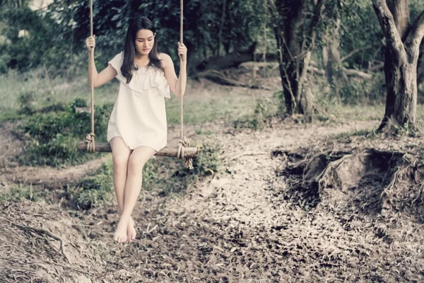 Beautiful women are sitting swings waiting someone.dream soft st — Stock Photo, Image