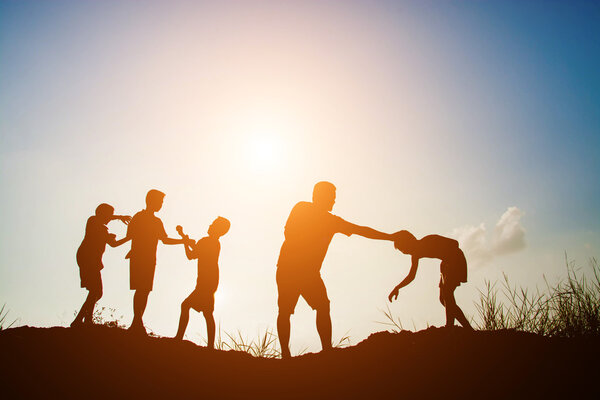 Children playing on summer sunset happy time