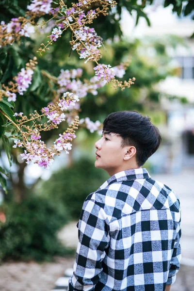 Young Man Striped Shirt Standing Roadside Holding Flower — Stock Photo, Image