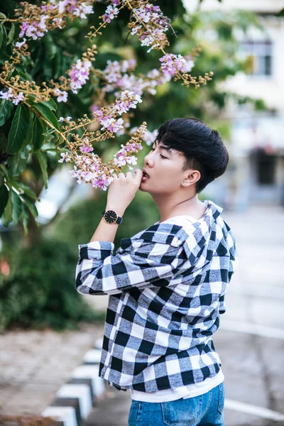 Young Man Striped Shirt Standing Roadside Holding Flower — Stock Photo, Image