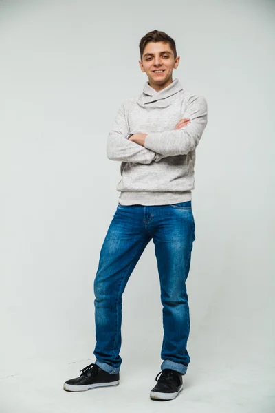 Homem sweatshirt e jeans branco fundo Fotos De Bancos De Imagens
