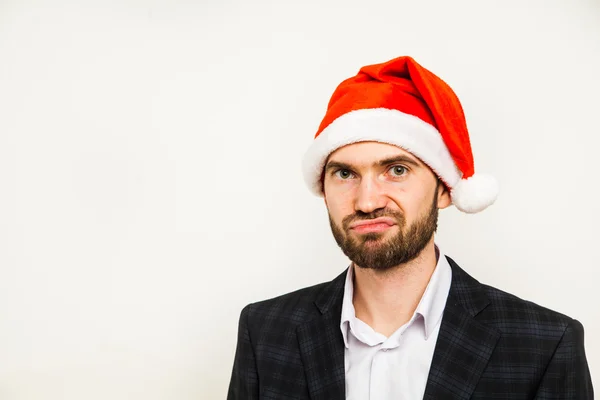 Businessman in suit with santa hat on head. Isolated over white background — Stock Photo, Image