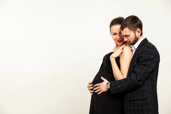 Young happy cheerful pregnant woman with husband together — Stock Photo, Image