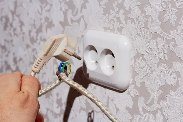 Man Hand Holds Electric Plug Damaged Cable Danger Electric Shock — Stock Photo, Image