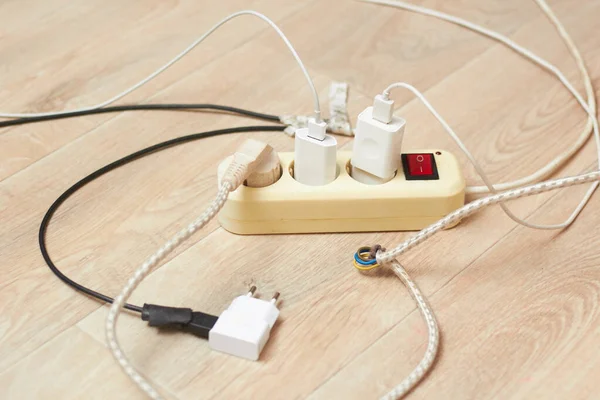 The photo shows an extension cord with a large current consumption. the concept of high energy consumption.