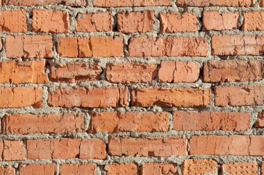 Tuğla duvar eskimiş. arkaplan tuğla duvar çimento harcı ile lekeli kırmızı tuğla