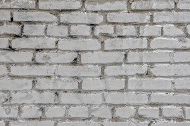 Gri tuğlalı gri duvar kaplama arka plan. Tuğla gri arka plan. düz olmayan tuğla işi eski