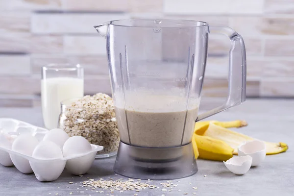 Oat pancakes with banana. Step by step cooking process. Ingredients top view. Bananas, milk, eggs, oats, salt. Wooden table background. Copy space. — Stock Image Oat Pancakes Banana Step Step Cooking Process Ingredients Top View Stock Image