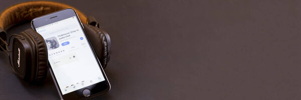 Minsk, Belarus - 02.21.2021: View of the Clubhouse app on a smartphone, a controversy of 2021 hidden behind the Social app. The fall of the club in the audio chat application on the smartphone.