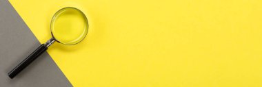 Magnifying glass on a colored background with a place for your text