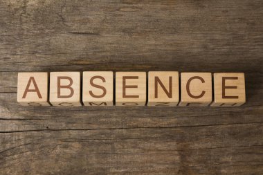 the word of ABSENCE on a wooden cubes clipart